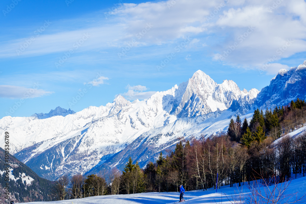 Beautiful landscape of snowy mountain view with sprouce of pine tress in Bellvue Saint-Gervais-les-Bains. Alps mountain top near Mont Blanc. Famoust place for winter sport like skiing with family