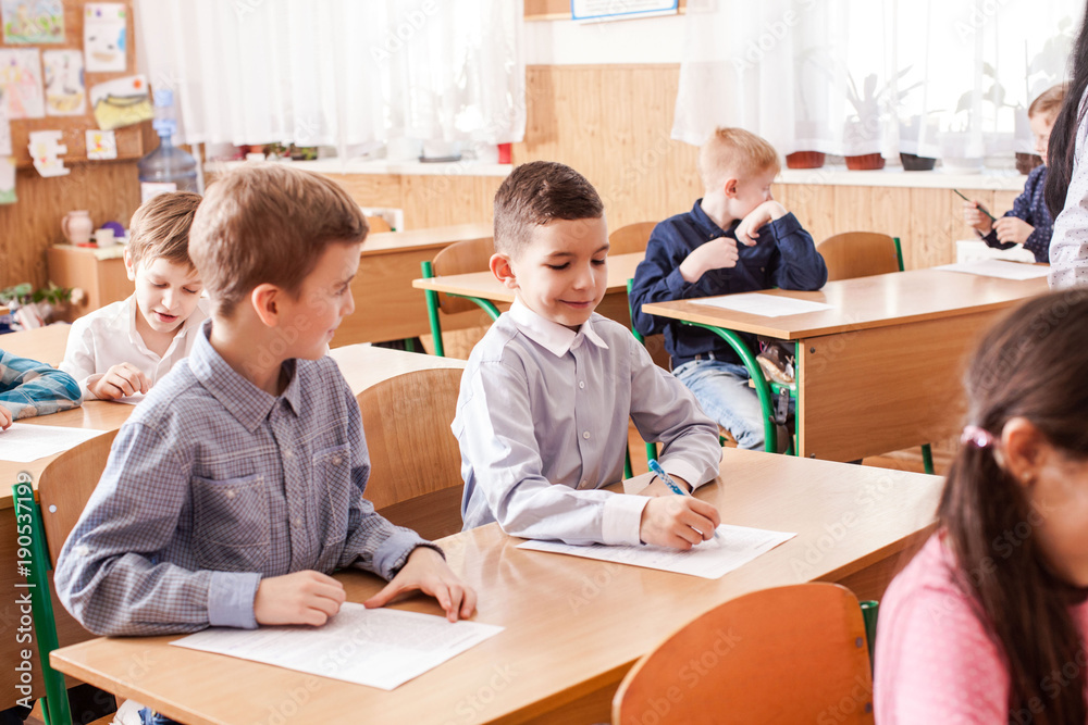Fototapeta premium Children taking an exam