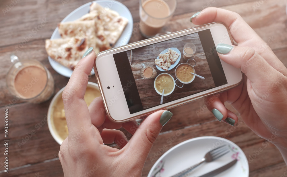 Food photo of indian food on wooden table for social networks