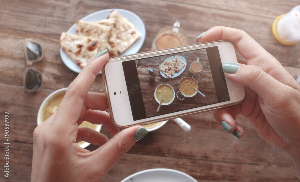 Food photo of indian food on wooden table for social networks