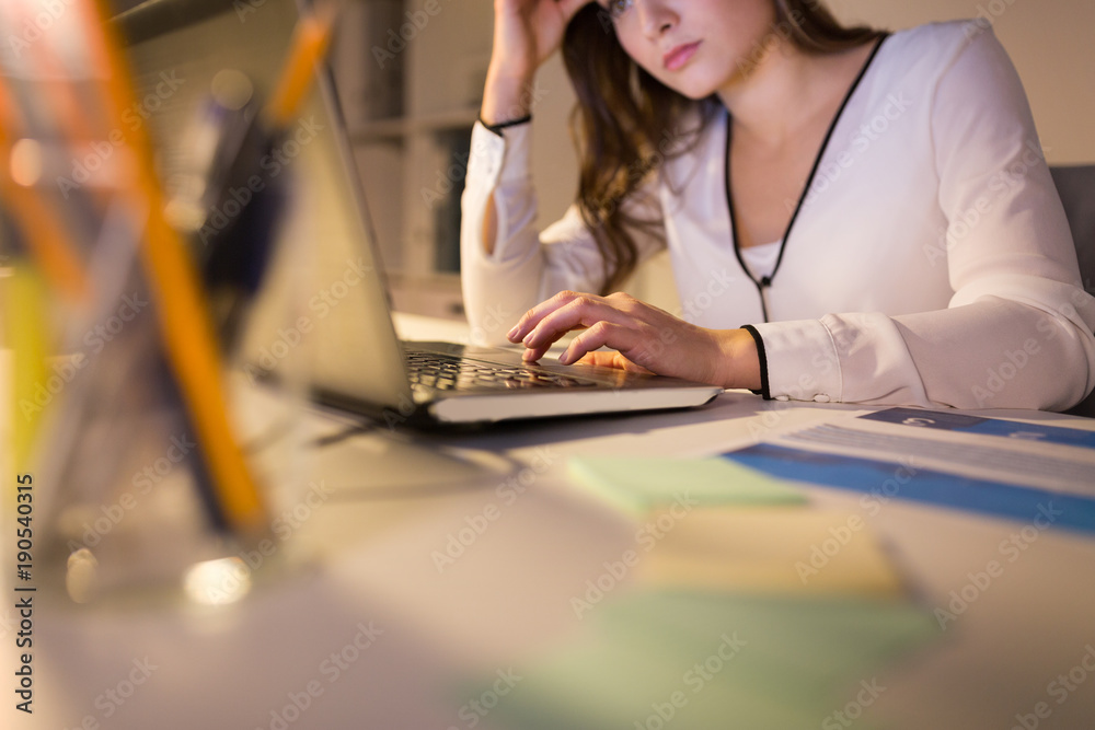 businesswoman with laptop working at night office businesswoman with laptop working at night office