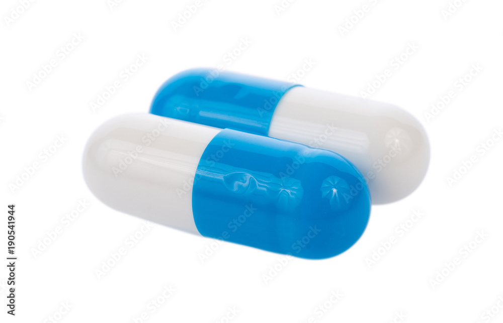 blue pills capsules isolated on white background