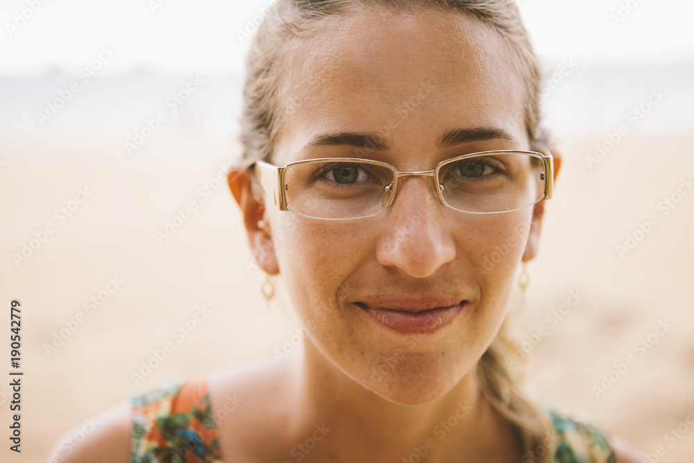 Close-up portrait of smiling woman at beach Close-up portrait of smiling woman at beach