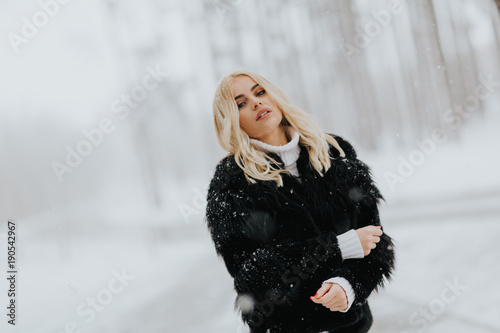 Pretty young blonde woman a...