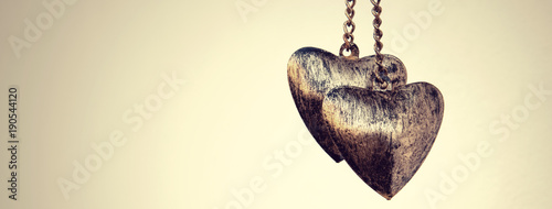 фотографія golden horizontal picture with two hearts, love concept for Valentine day with c