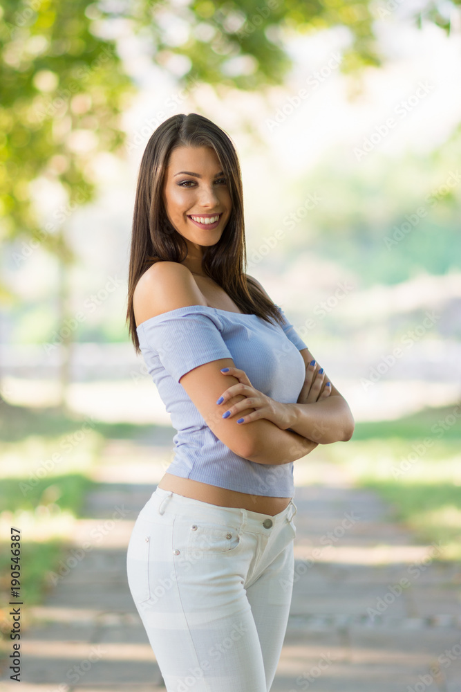 Gorgeous young woman posing in park in spring Gorgeous young woman posing in park in spring