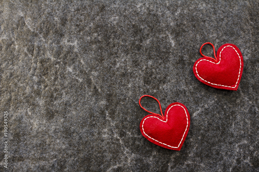 Obraz premium Red beautiful hearts on a marble background. Valentine's Day. 