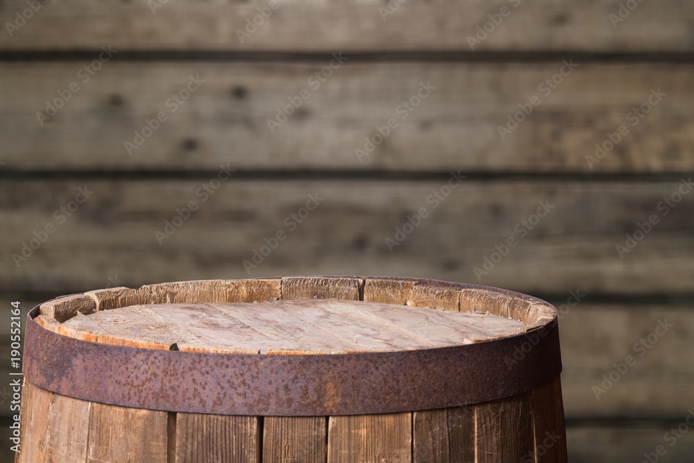 Old wooden barrel on wooden background Old wooden barrel on wooden background