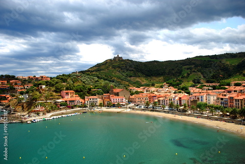 Fototapeta Naklejka Na Ścianę i Meble -  A view of the bay and beach of Collioure in the south of France with Saint Elme Fort on the hill