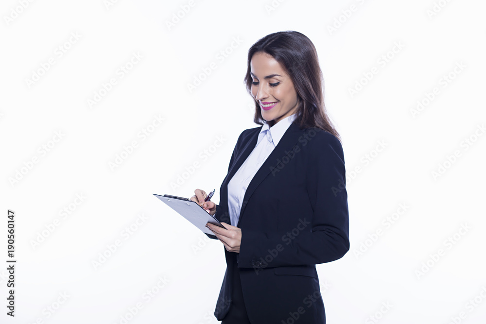Young smiling confident business woman holding a tablet information isolated on white background. Concept of office work. Young smiling confident business woman holding a tablet information isolated on white background. Concept of office work.