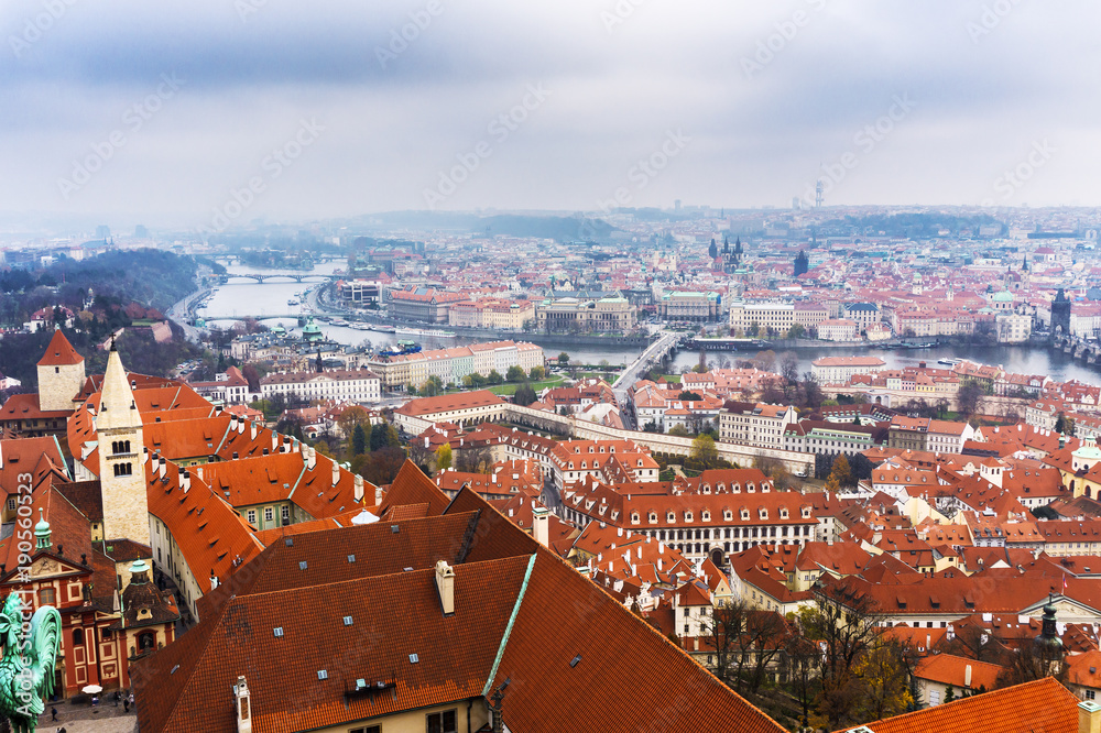 Prague in Autumn time, classical view on red roofs in central part of city.