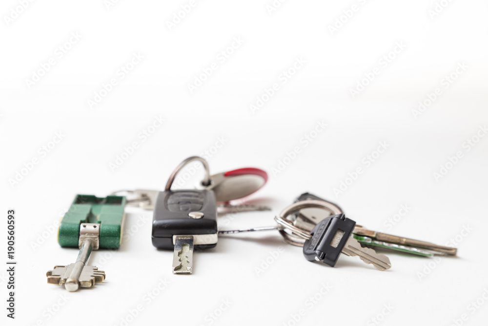 several key rings with different keys on white background