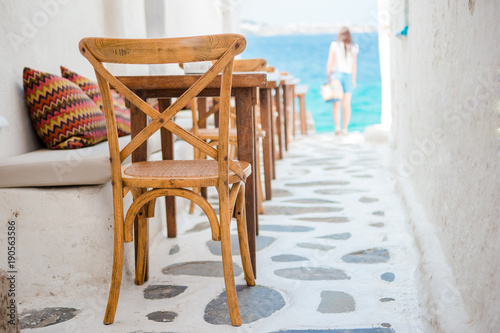 Beautiful typical greek outdoor cafe in Mykonos with amazing sea view on Cyclades islands
