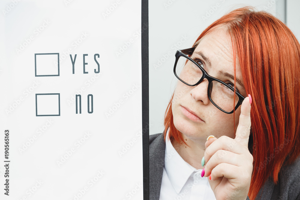 Business politics concept of choice and voting. Woman in suit and glasses makes yes or no choice. With place for advertising text. Chef Day, Boss Day, Elections, democratic, tyrannis. What to do
