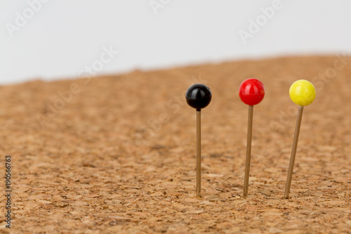 pins in pin board in german colors black, red, gold,