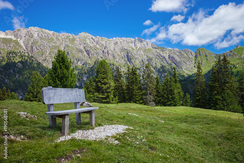 Bench in amazing mountain valley, Dolomite Alps, Italy