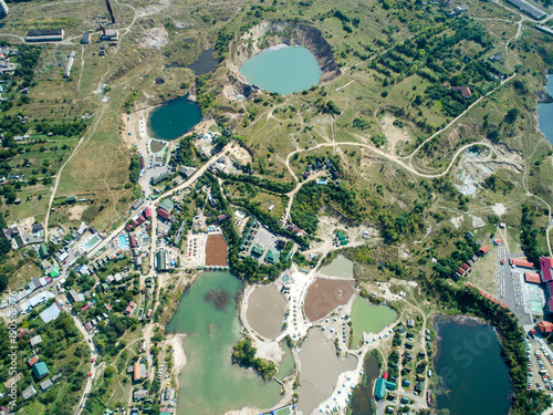 Aerial wiev: Large karst dips due to flooded salt mines near the resort photo