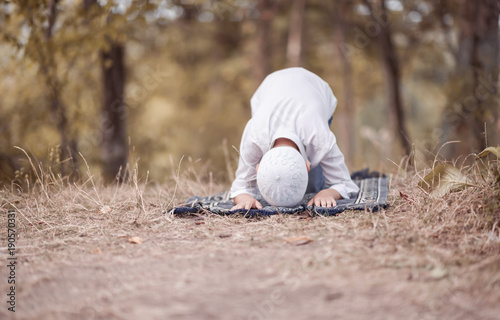 Photography Ramadan Kareem,beautiful boy Muslim is praying in mosque,Peace and love in the h