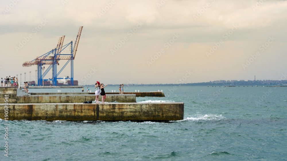 Odessa, Ukraine - Jan 13, 2018: Port cranes of the Port of Odessa / Odessa Marine Trade Port on the Black Sea. Odessa, Ukraine - Jan 13, 2018: Port cranes of the Port of Odessa / Odessa Marine Trade Port on the Black Sea.
