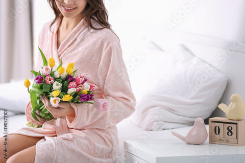 Beautiful woman with bouque...