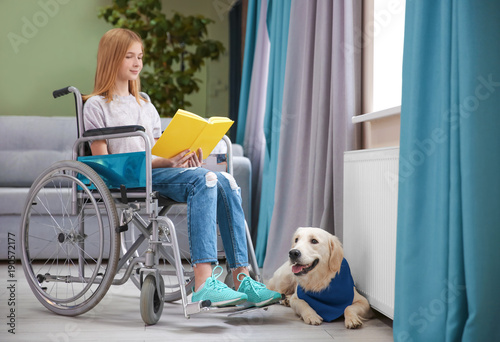 Girl in wheelchair reading ...