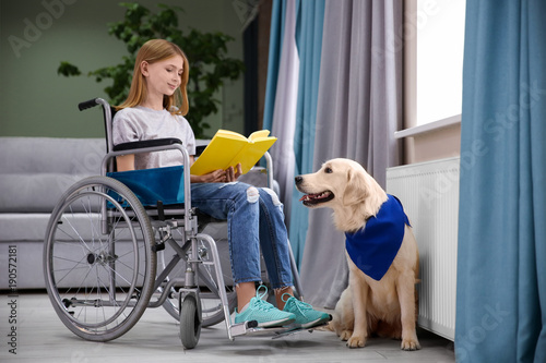 Girl in wheelchair reading ...