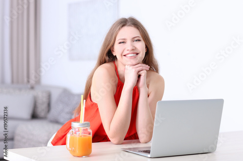 Woman using laptop indoors