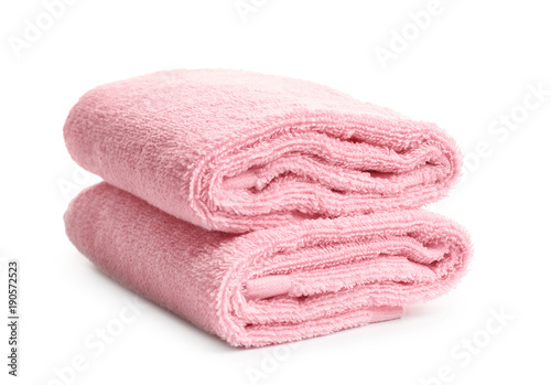 Folded clean terry towels on white background
