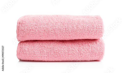 Folded clean terry towels on white background