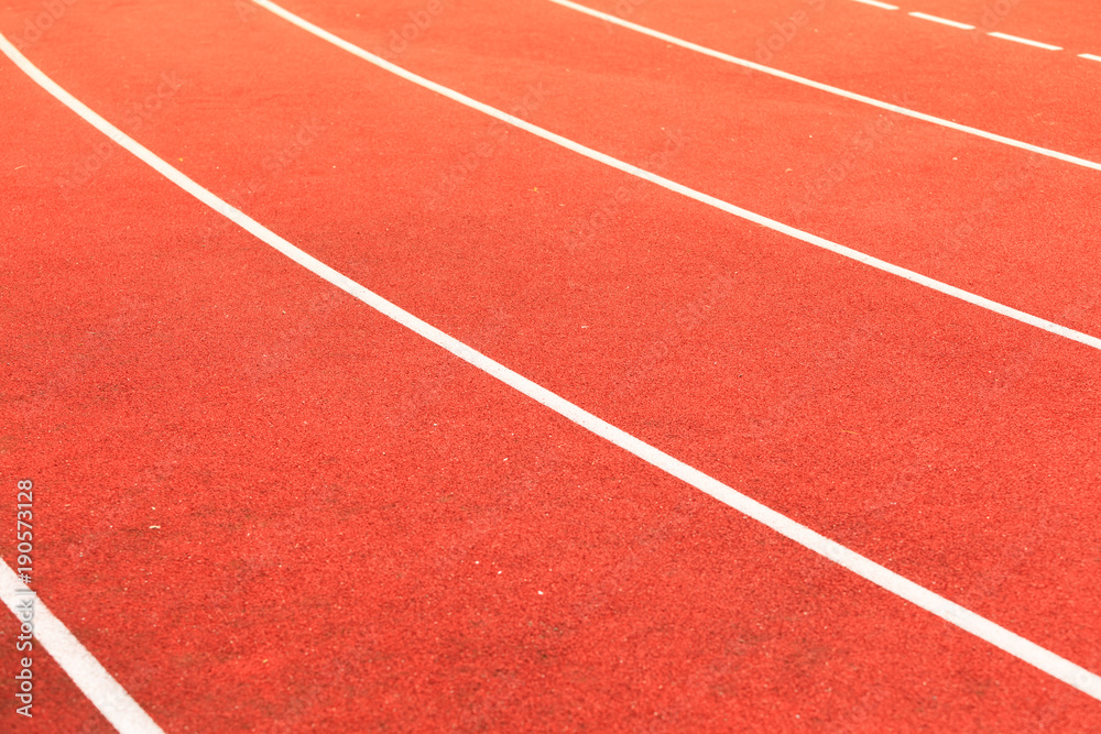 Red running track in stadium.