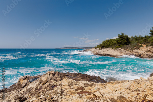 Rocky shore of the Adriatic sea after storm