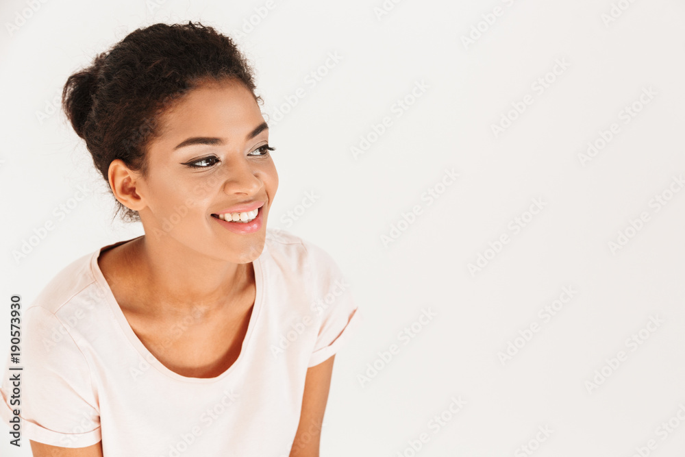 Portrait of beautiful african american woman smiling and looking aside on copyspace, isolated over white background Portrait of beautiful african american woman smiling and looking aside on copyspace, isolated over white background