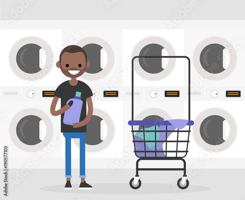 Daily routine. Young character washing clothes in a public coin laundry. Flat editable vector illustration, clip art