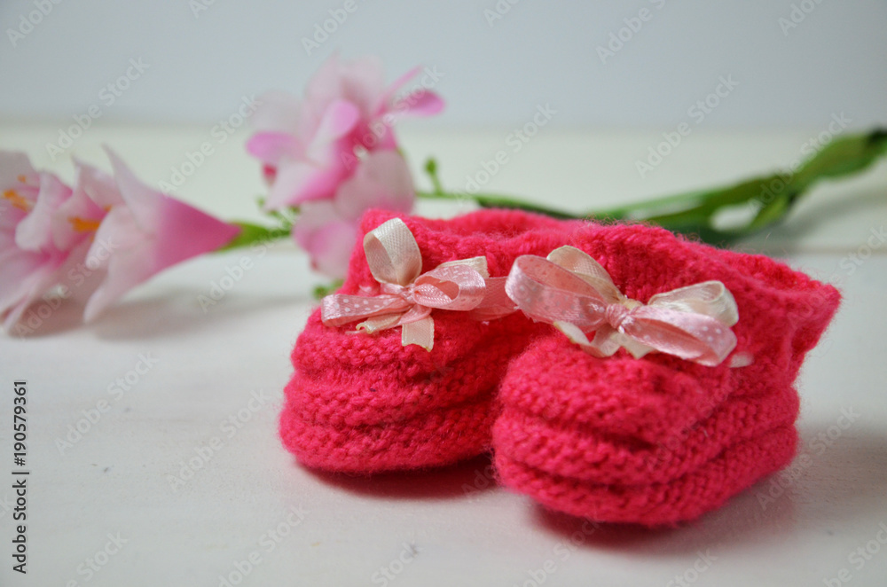 Baby girl knitted sandal, booties, shoes baby newborn, blank postcard. cocept it s a girl or baby shouer Baby girl knitted sandal, booties, shoes baby newborn, blank postcard. cocept it s a girl or baby shouer
