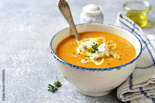 Obraz na plátne Thick pumpkin soup with feta cheese and thyme.