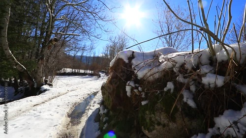 snowy path in winter in Pyrenees with shining sun filmed in traveling, Aude in south of France
 photo