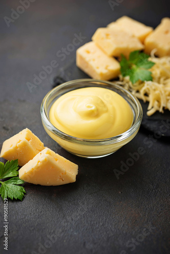 Homemade cheese sauce in glass bowl