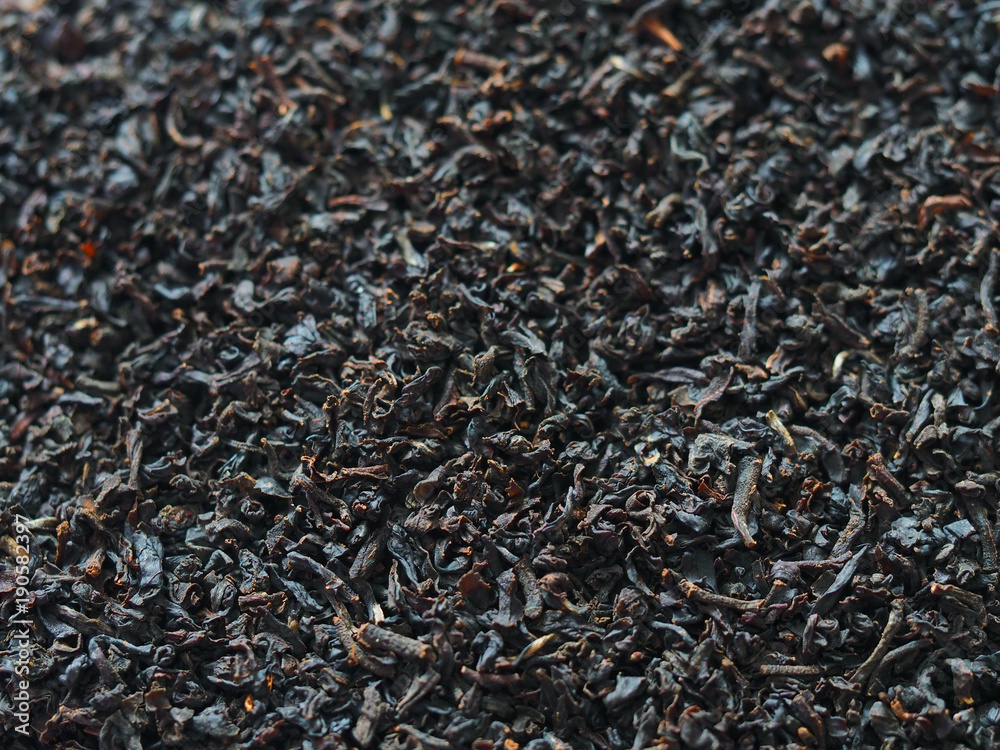 Black leaf tea background. Selective focus Black leaf tea background. Selective focus