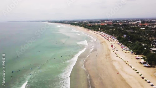 Sea with a white sand beach. Aerial view from above. Sea waves. Sand beach aerial, top view of a beautiful sandy beach aerial shot with the blue waves rolling into the shore. Soft wave of the sea