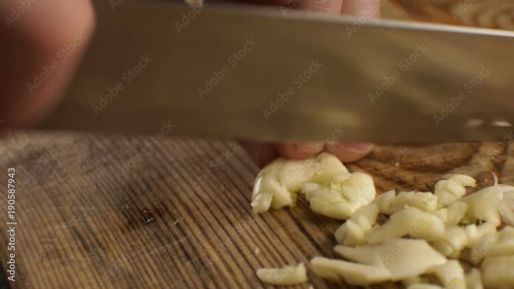 Sliced garlic for sauce side view. Video Sliced garlic for sauce side view. Video