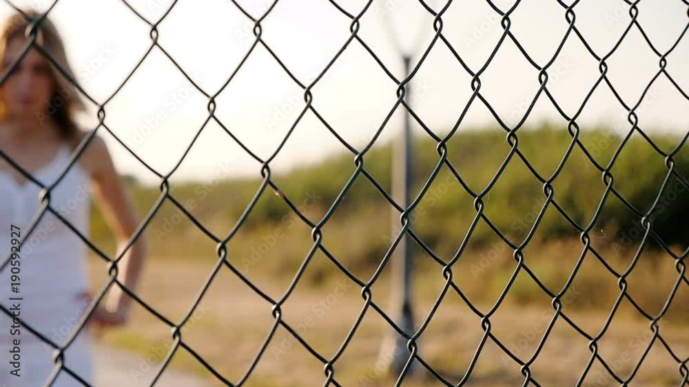 Blurred sad and lonely woman Woman Holding net- outdoor Blurred sad and lonely woman Woman Holding net- outdoor