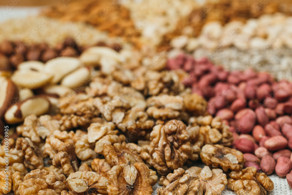 Nuts mix in a canvas bag in table. Ten kinds of nuts: pecan, brazil, cedar, sunflower, hazelnut, almond, peanut walnut pistachio cashew Nuts mix in a canvas bag in table. Ten kinds of nuts: pecan, brazil, cedar, sunflower, hazelnut, almond, peanut walnut pistachio cashew