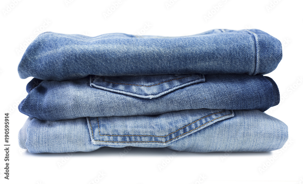 Stack of blue jeans isolated on white Stack of blue jeans isolated on white