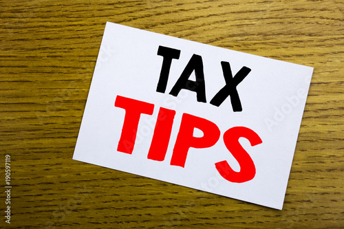 Tax Tips. Business concept for Taxpayer Assistance Refund Reimbursement written on sticky note, wooden wood background with copy space.