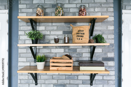 Wooden shelves with different home related objects.