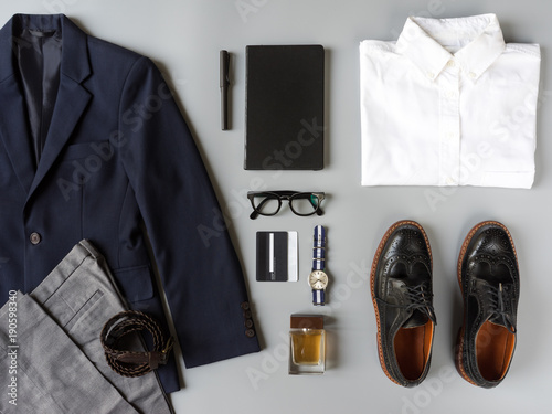 Top view of business clothing, Set of classic fashion and accessories on grey background