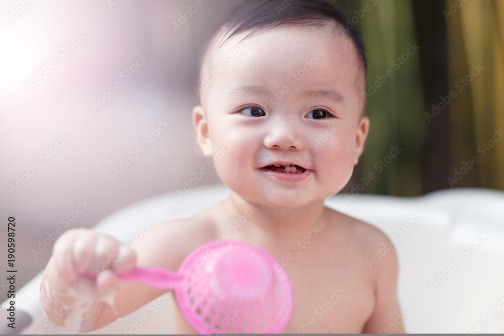 Close-up of a baby boy taking bath Close-up of a baby boy taking bath