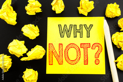 Handwritten text showing Why Not Question. Business concept writing for Leadership Motivation written on sticky note paper on the black background. Folded yellow papers on the background photo