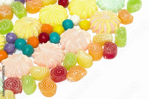 Fototapeta Naklejka Na Ścianę i Meble -  Multi-colored sweets on a white background. Sweets sweet on white background.
