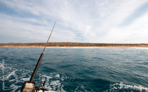 View of fishing rod on charter fishing boat on the Pacific side of Cabo San Lucas in Baja California Mexico BCS